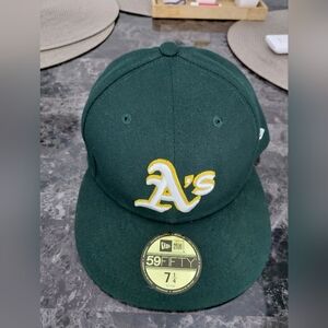 New Era Dark Green 59FIFTY Cap with Yellow Logo 7 1/4 OAKLAND A'S. Used.